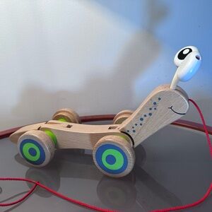 Hape Wooden Walk Along Pull Toy Snail Worm Wobbly Eyes Wheels Kids